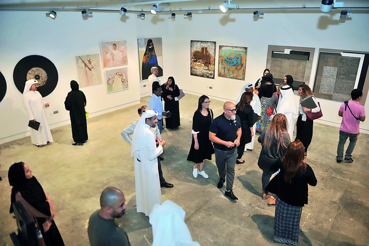 Visitors at the opening of ‘Reflection’ exhibition which marked the launch of Al Markhiya Gallery at Fire Station yesterday. Pic: Baher Amin / The Peninsula