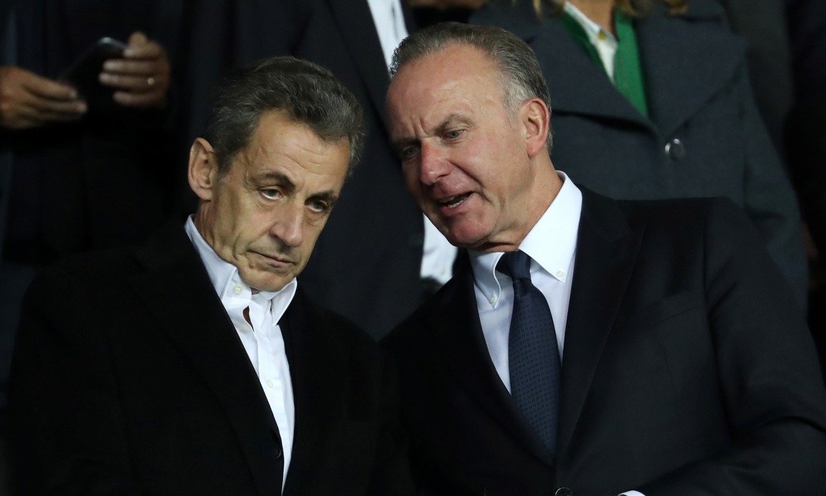 Former French President Nicolas Sarkozy (L) and former German football player and Bayern Munich CEO Karl-Heinz Rummenigge (R) attend during the UEFA Champions League Group B match between Paris Saint-Germain (PSG) and Bayern Munich at Parc des Princes Sta