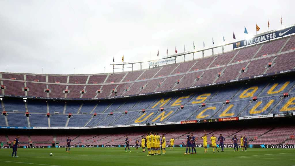 General view as Barcelona’s Lionel Messi prepares to take a freekick in the empty stadium as the game is played behind closed doors. REUTERS/Albert Gea