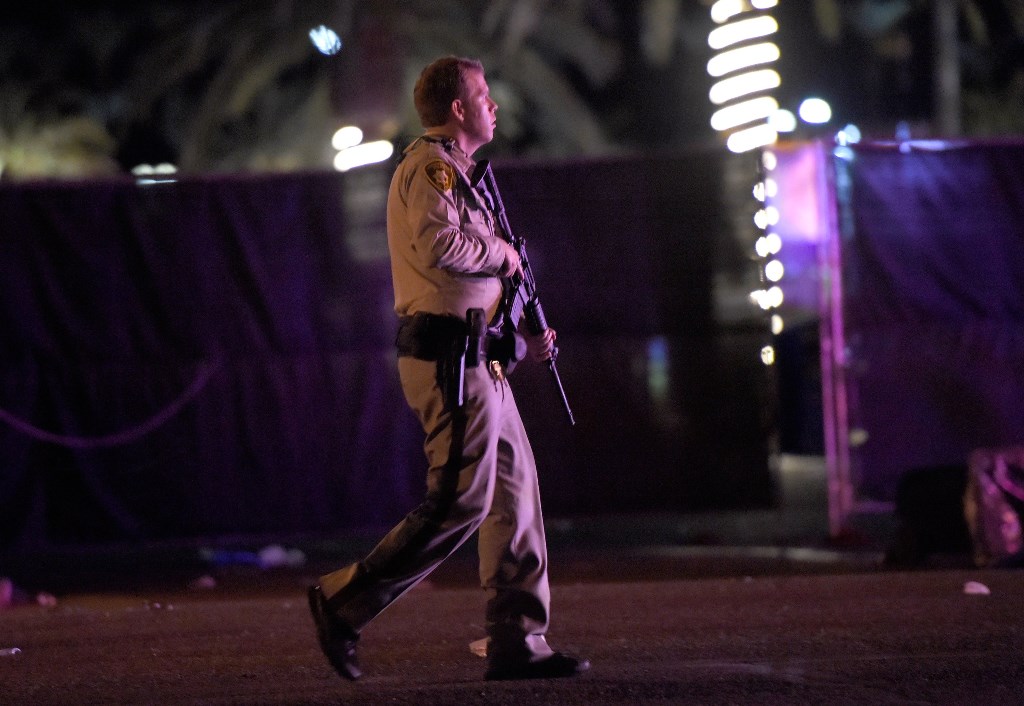 LAS VEGAS, NV - OCTOBER 02: Las Vegas police patrol along the streets outside the the Route 91 Harvest country music festival grounds after a active shooter was reported on October 1, 2017 in Las Vegas, Nevada. A gunman has opened fire on a music festival