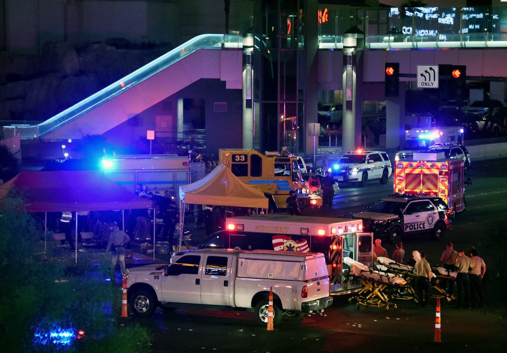 Police and rescue personnel gather at the intersection of Las Vegas Boulevard and Tropicana Ave. after a mass shooting at a country music festival nearby on October 2, 2017 in Las Vegas, Nevada. Ethan Miller/AFP
