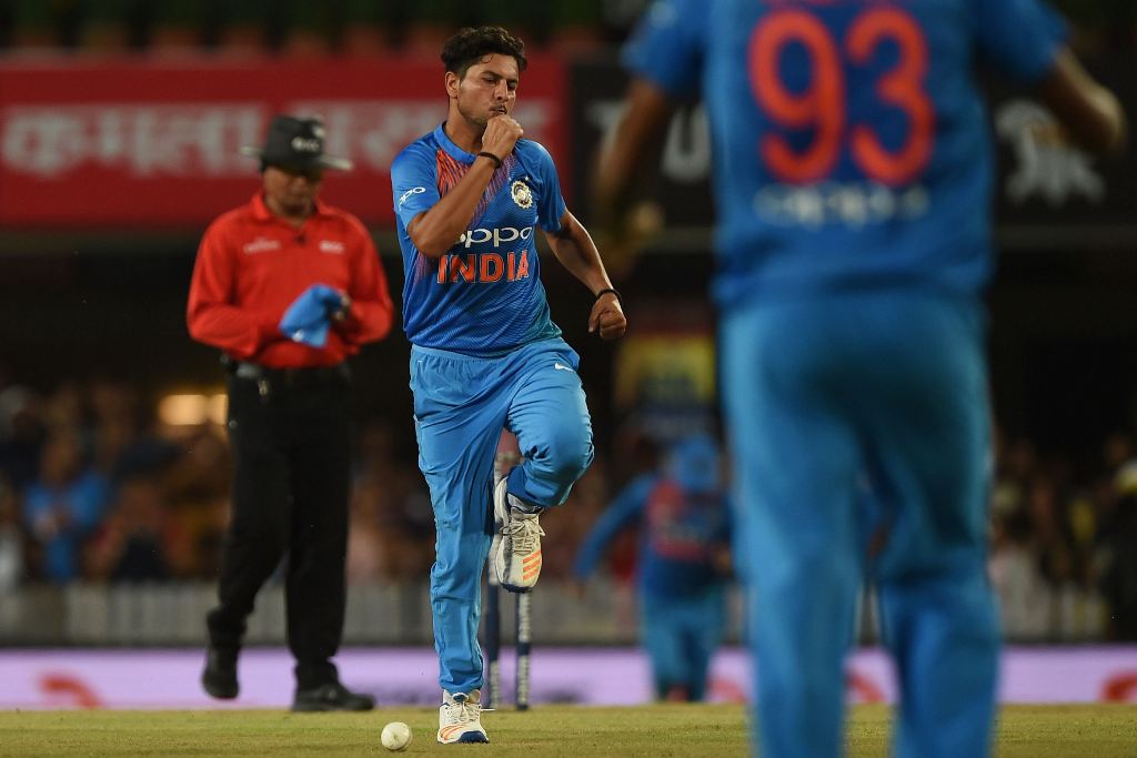 India's Kuldeep Yadav (C) celebrates the wicket of Australia's Aaron Finch during the first twenty 20 match between India and Australian at the JSCA international stadium in Ranchi on October 7, 2017. (AFP / Money SHARMA)