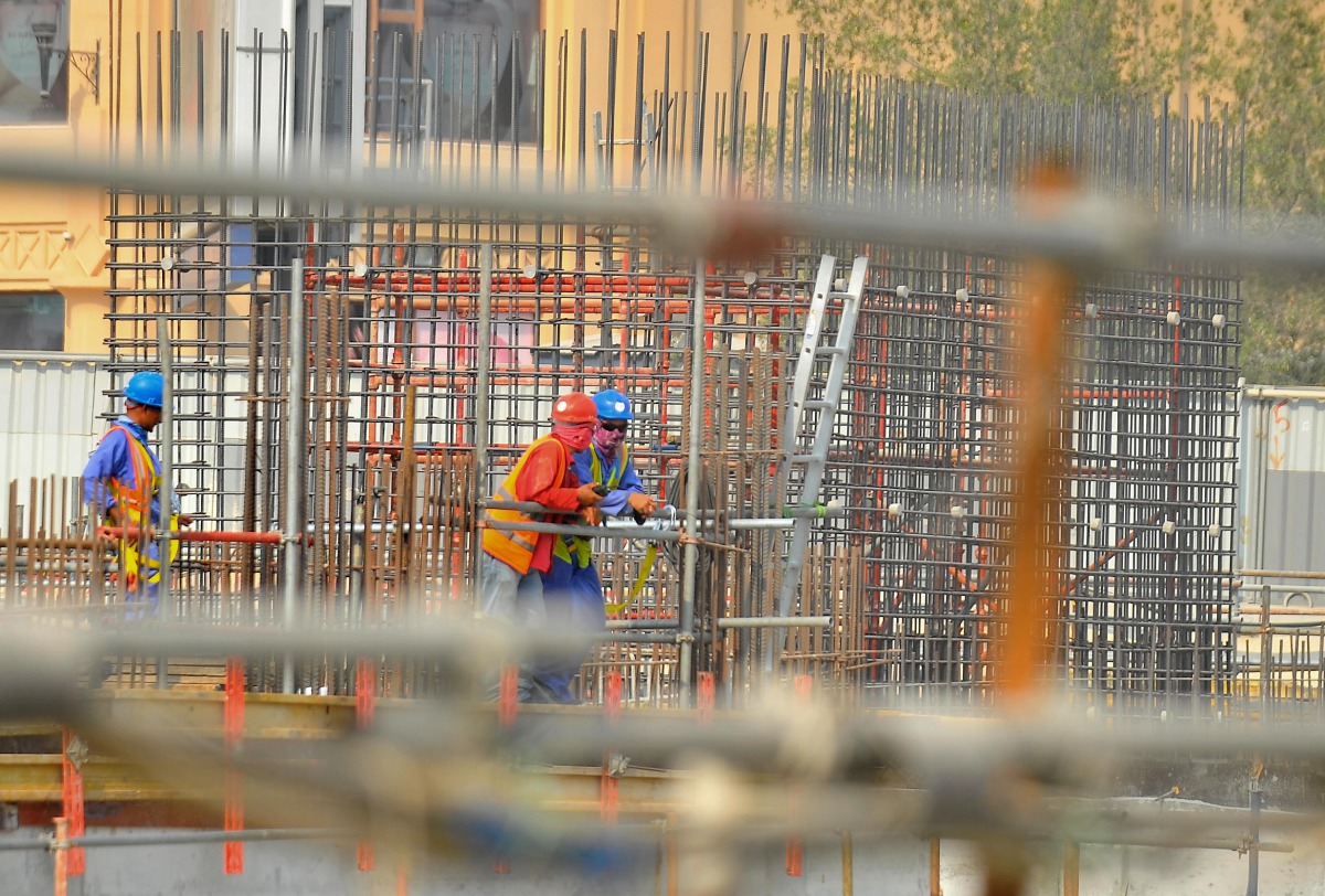 (File photo) Construction workers at a Doha Project. Baher Amin © The Peninsula