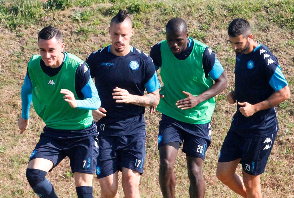Napoli's Spanish striker Jose Maria Callejon (L), Napoli's Slovakian midfielder Marek Hamsik (2ndL), Napoli's French defender Kalidou Koulibaly (2ndR) and Napoli's Spanish defender Raul Albiol attend a training session on the eve of the UEFA Champions Lea