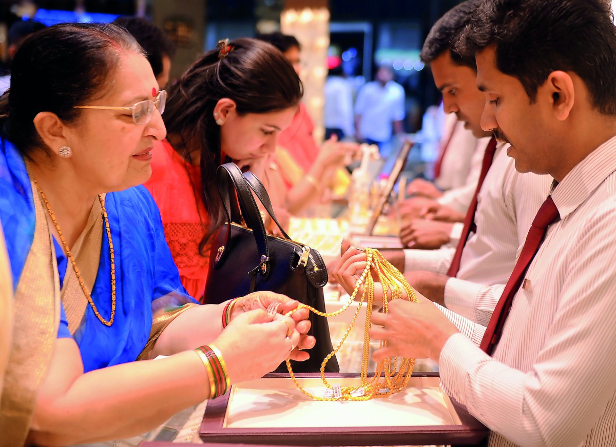 Indian expatriates purchasing gold at Malabar Gold and Diamonds showroom in Al Watan Center, yesterday, in view of Dhanteras and Diwali.  Pic: Abdul Basit / The Peninsula 