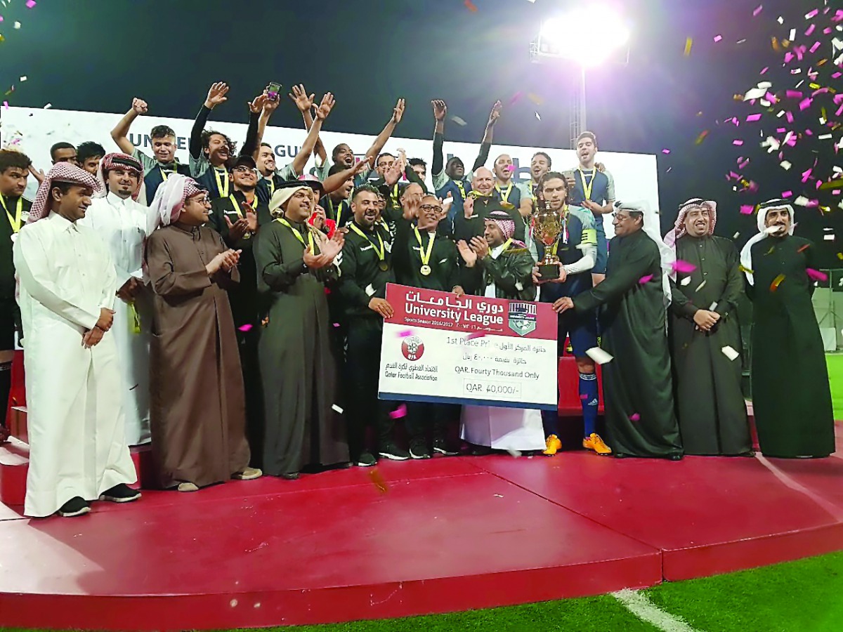 Qatar University players and team officials celebrate with tournament officials after they emerged University League football champions at Qatar Foundation’s Recreation Centre Pitch 1 in this file picture of February 2017.