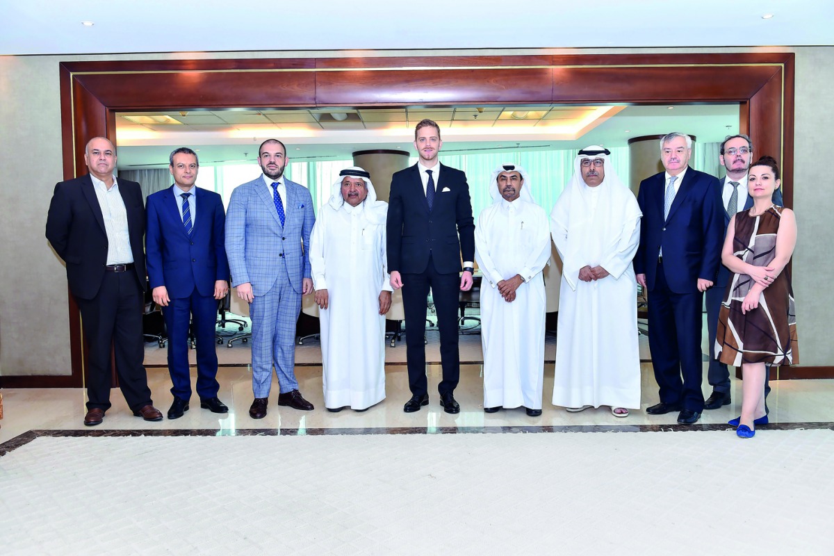 Sheikh Faisal bin Qasim Al Thani (fourth left), QBA Chairman; Ilan Laufer (fourth right), Romanian Minister for Business Environment, Commerce and Entrepreneurship; and Dr Cristian Tudor (third left) Ambassador of the Republic of Romania to Qatar along wi