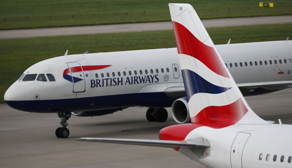 FILE PHOTO: British Airways planes are parked at Heathrow Terminal 5 in London, Britain May 27, 2017. REUTERS/Neil Hall/File Photo