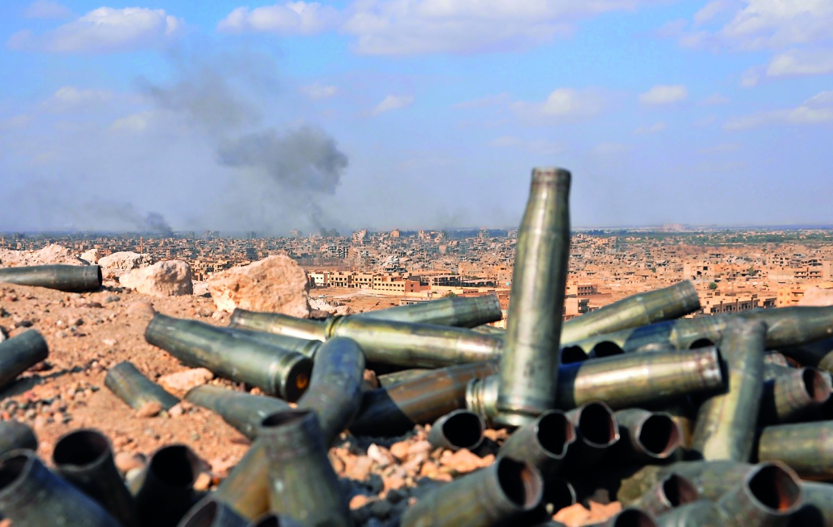 Smoke billows from the eastern Syrian city of Deir Ezzor during an operation by government forces against Islamic State militants. Army and allied forces have taken full control of Deir Ezzor from the IS. 