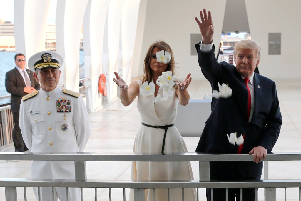 US President Donald Trump and first lady Melania Trump scatter flower petals in the water at the USS Arizona Memorial in Honolulu, Hawaii, U.S. November 3, 2017. REUTERS/Jonathan Ernst