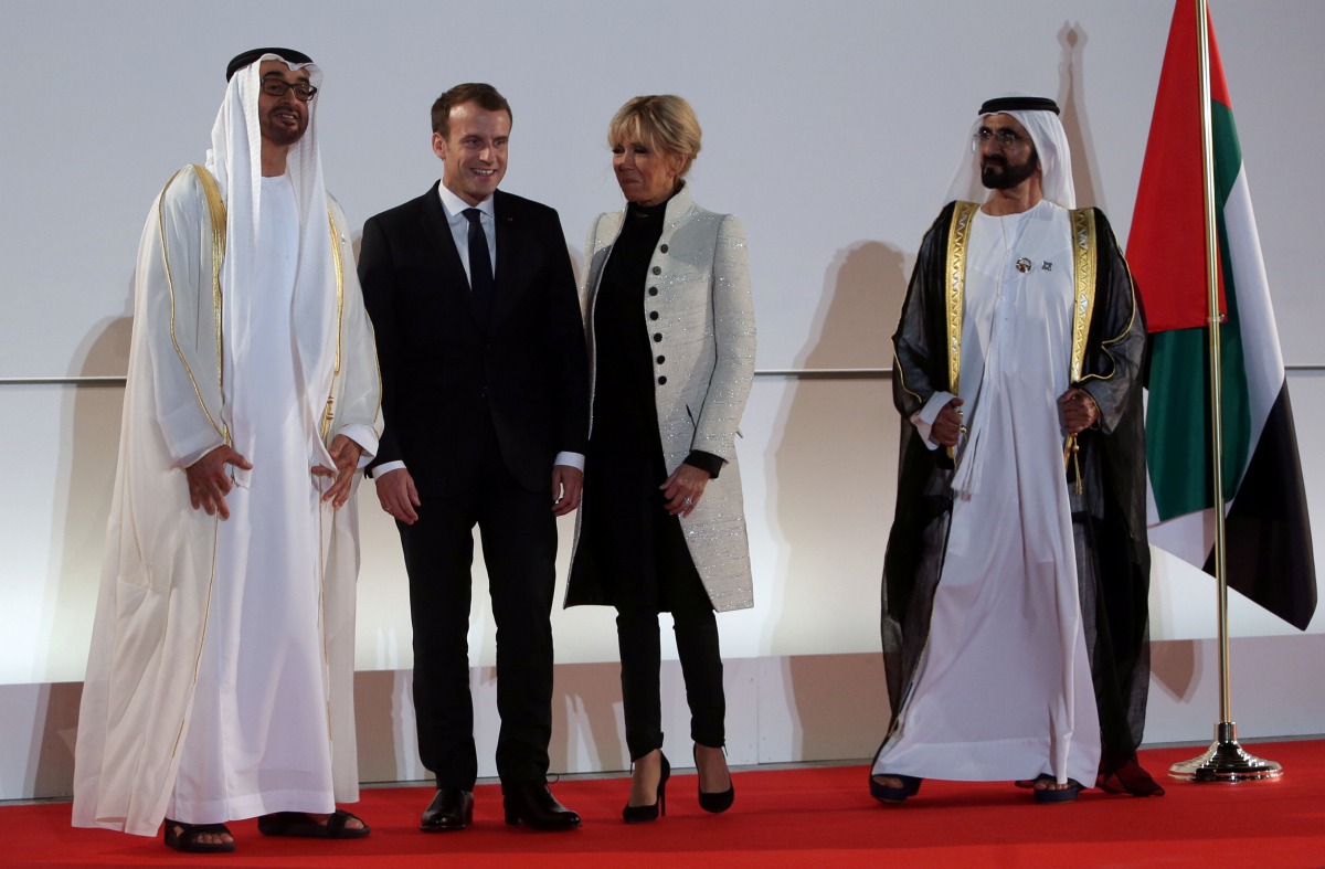 Abu Dhabi Crown Prince Sheikh Mohammed bin Zayed al-Nahyan, French President Emmanuel Macron, Brigitte Macron and Prime Minister and Vice-President of UAE and Ruler of Dubai Sheikh Mohammed bin Rashid al-Maktoum pose for a photo at the Louvre Abu Dhabi, i