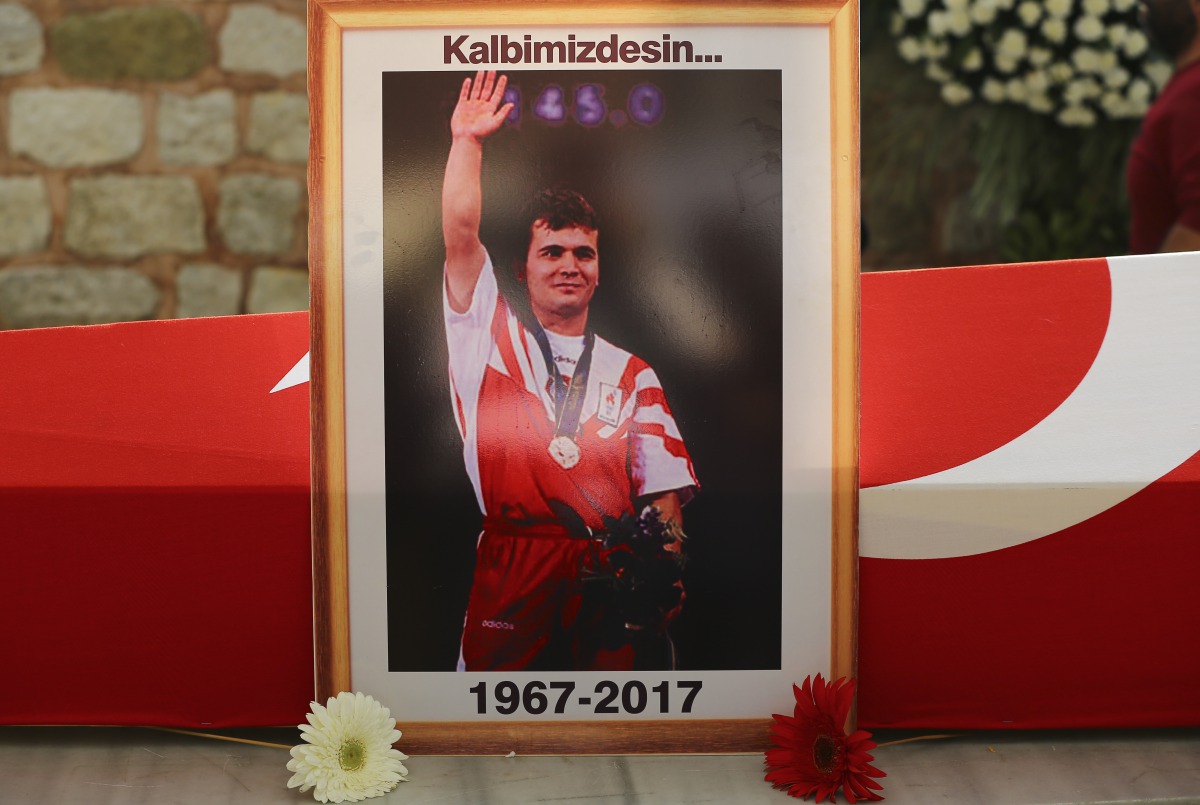 A framed picture of Turkish weightlifting legend, 3-time Olympic Champion Naim Suleymanoglu is seen during his funeral ceremony at Fatih Mosque in Istanbul, Turkey on November 19, 2017. (Emrah Yorulmaz - Anadolu Agency)