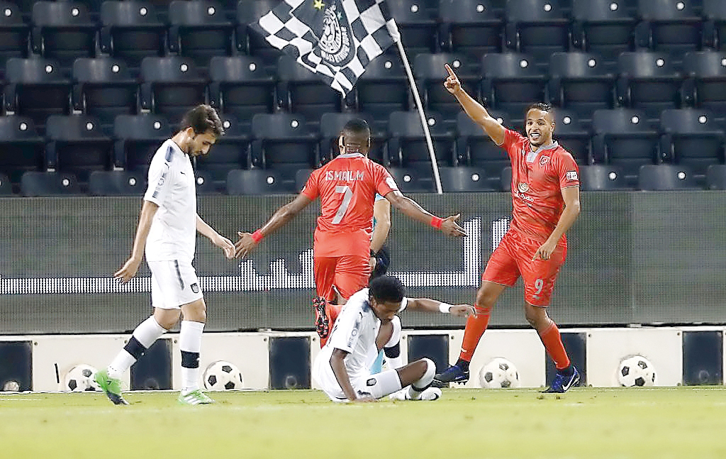 Al Duhail players celebrate after scoring a goal against Al Sadd during their QNB Stars League match played at Al Sadd Stadium yesterday.  