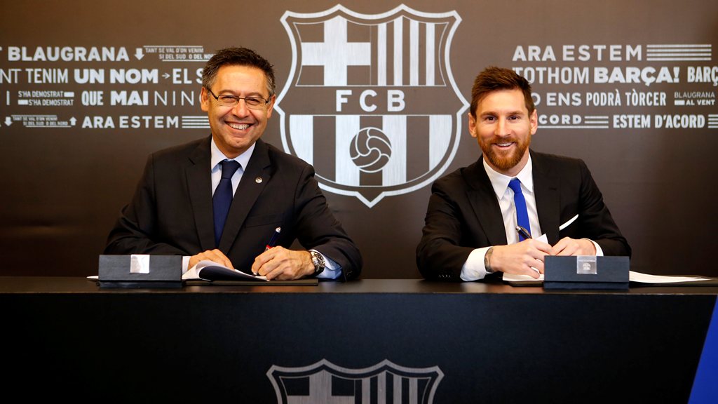 Barcelona's Argentine superstar Lionel Messi poses with FC Barcelona president Josep Maria Bartomeu during the signing of his new contract in Barcelona, Spain, November 25, 2017. German Parga/FC Barcelona
