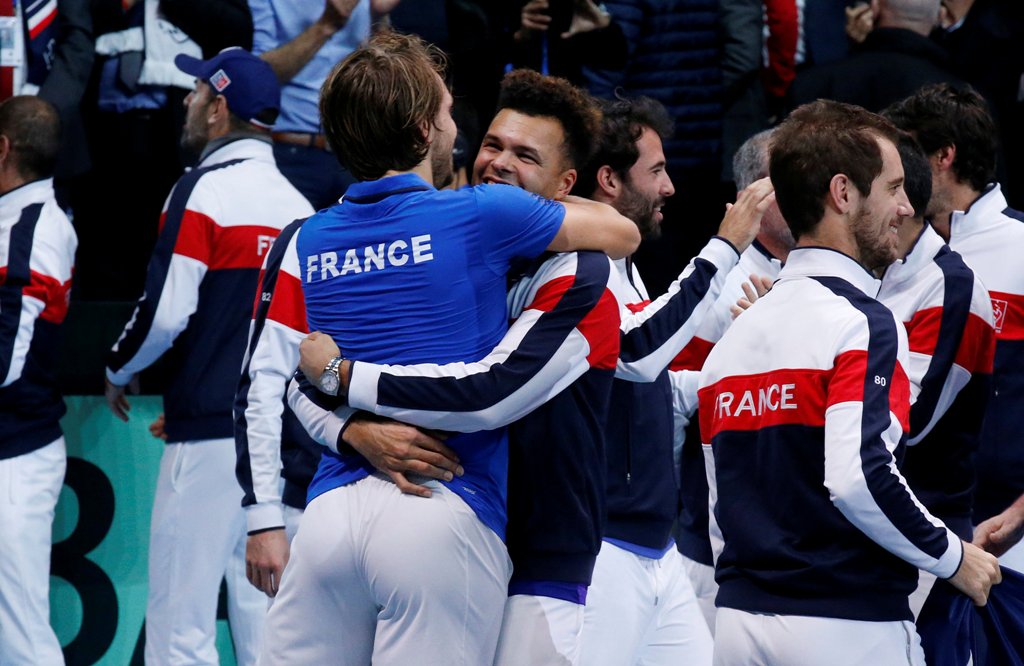 France's Lucas Pouille and with Jo-Wilfried Tsonga celebrate winning the Davis Cup REUTERS/Pascal Rossignol
