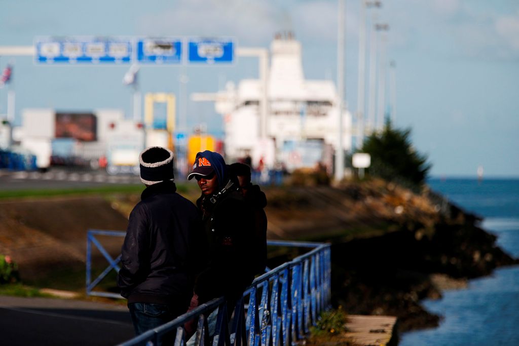 (FILES) This file photo taken on October 30, 2017 shows migrants waiting near the port of Ouistreham, near Caen, northwestern France.  AFP / CHARLY TRIBALLEAU
