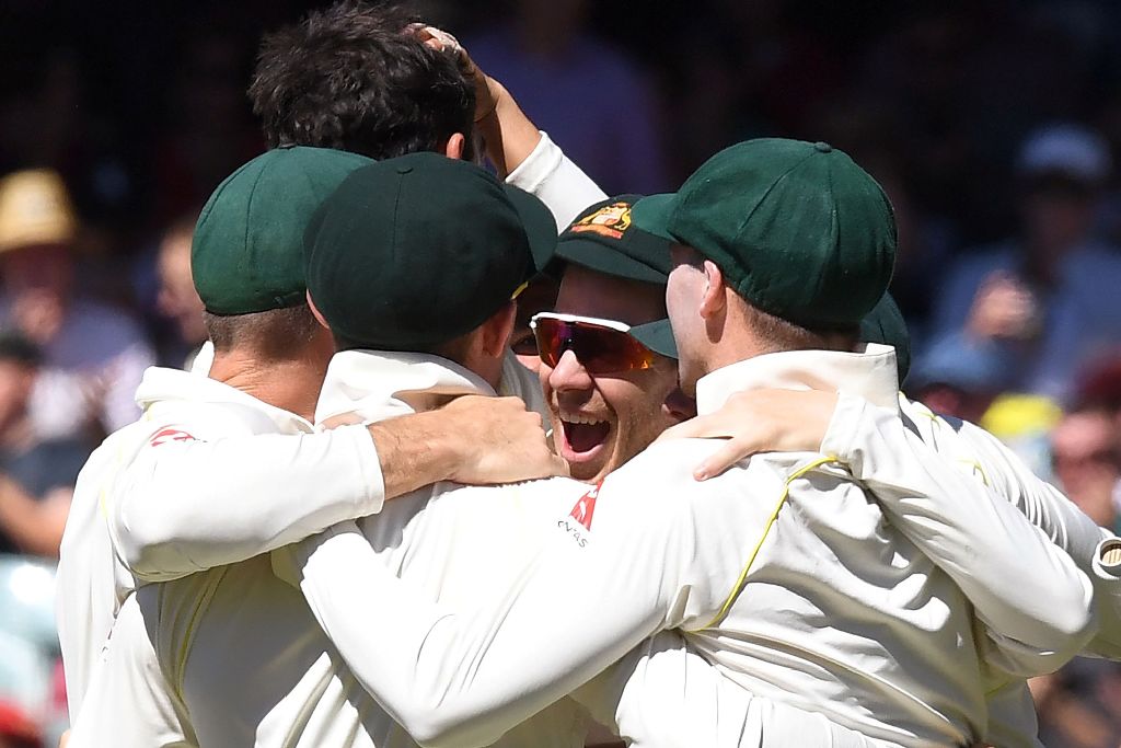 Australia's players react after they defeated England on the final day of the second Ashes cricket Test match in Adelaide in December 6, 2017. / AFP / William WEST