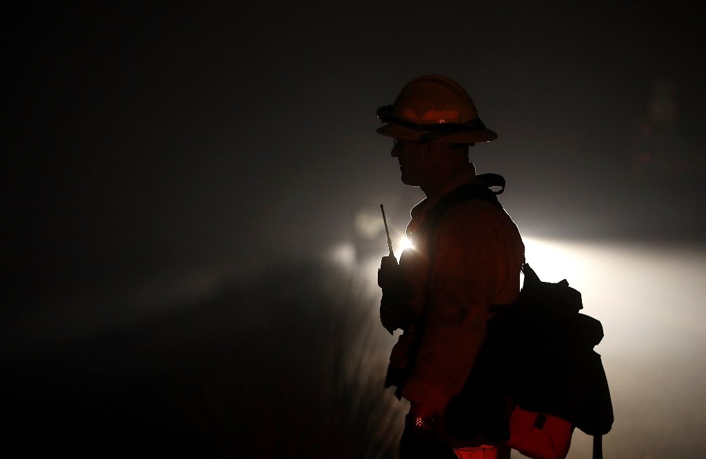 A firefighter monitors hot spots as the Thomas fire burns in the Los Padres National Forest on December 8, 2017 near Ojai, California. Justin Sullivan/AFP
