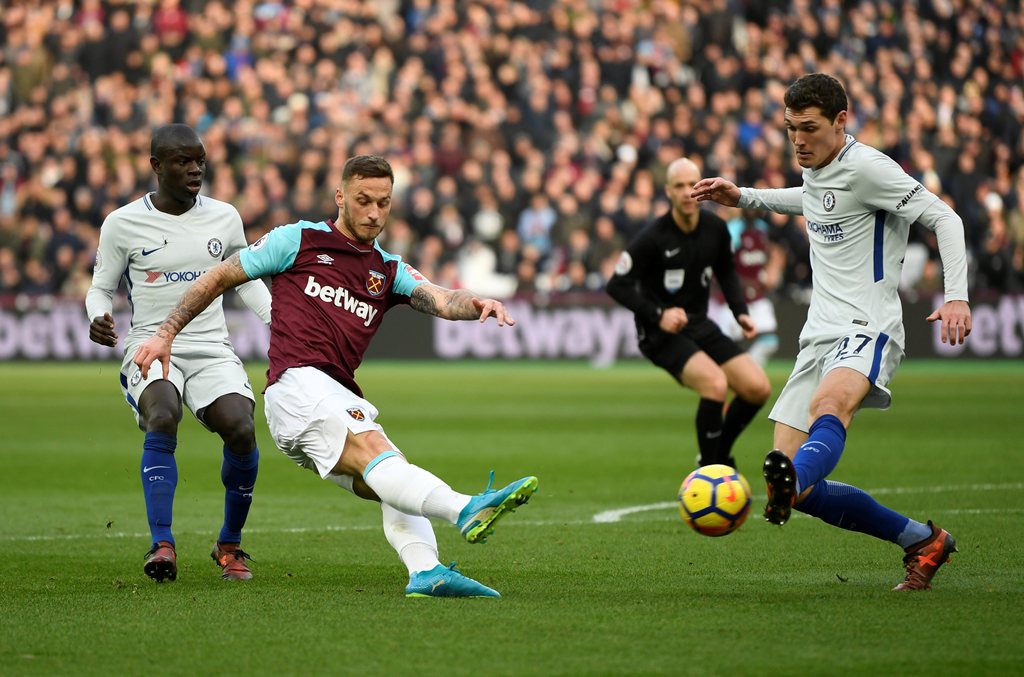 West Ham United's Marko Arnautovic has a shot at goal as Chelsea's Andreas Christensen attempts to block Action Images via Reuters/Tony O'Brien