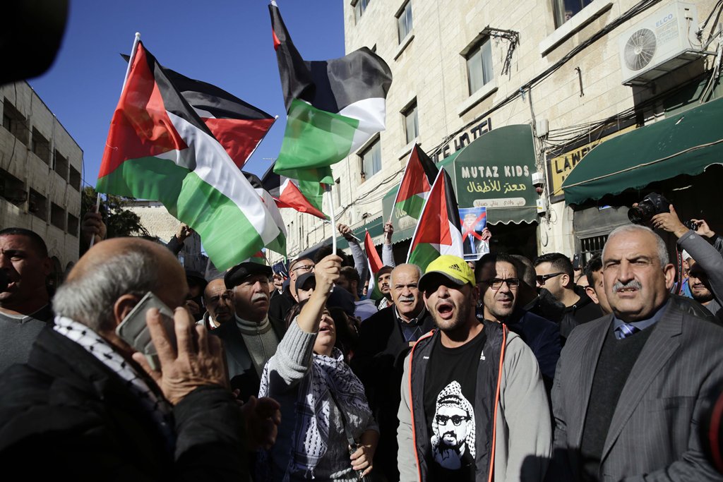 Palestinian demonstrators shout slogans during a protest against U.S. President Donald Trump’s announcement to recognize Jerusalem as the capital of Israel and plans to relocate the U.S. Embassy from Tel Aviv to Jerusalem, on December 9, 2017 in East Jeru