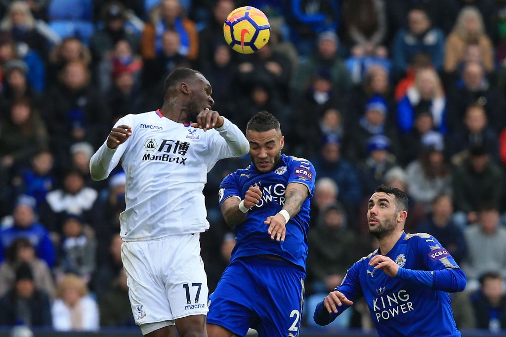Crystal Palace's Zaire-born Belgian striker Christian Benteke (L) vies with Leicester City's English defender Danny Simpson during the English Premier League football match between Leicester City and Crystal Palace at King Power Stadium in Leicester, cent