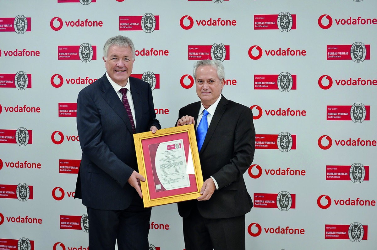 Selim Kseib presenting the certificate to Ian Gray.