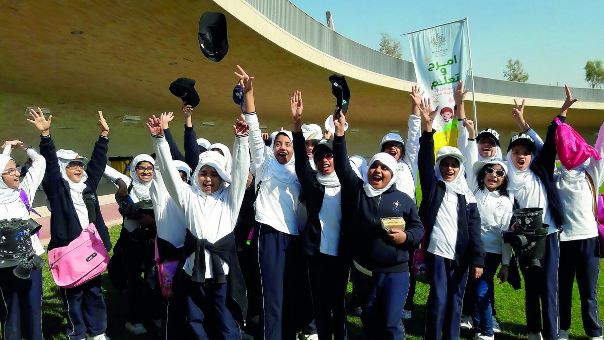 Students enjoying their time at the Quranic Botanic Garden.