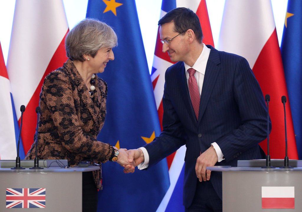 Poland’s Prime Minister Mateusz Morawiecki and Britain’s Prime Minister Theresa May shake hands during a news conference in Warsaw, Poland December 21, 2017. Slawomir Kaminski/Agencja Gazeta/ REUTERS 