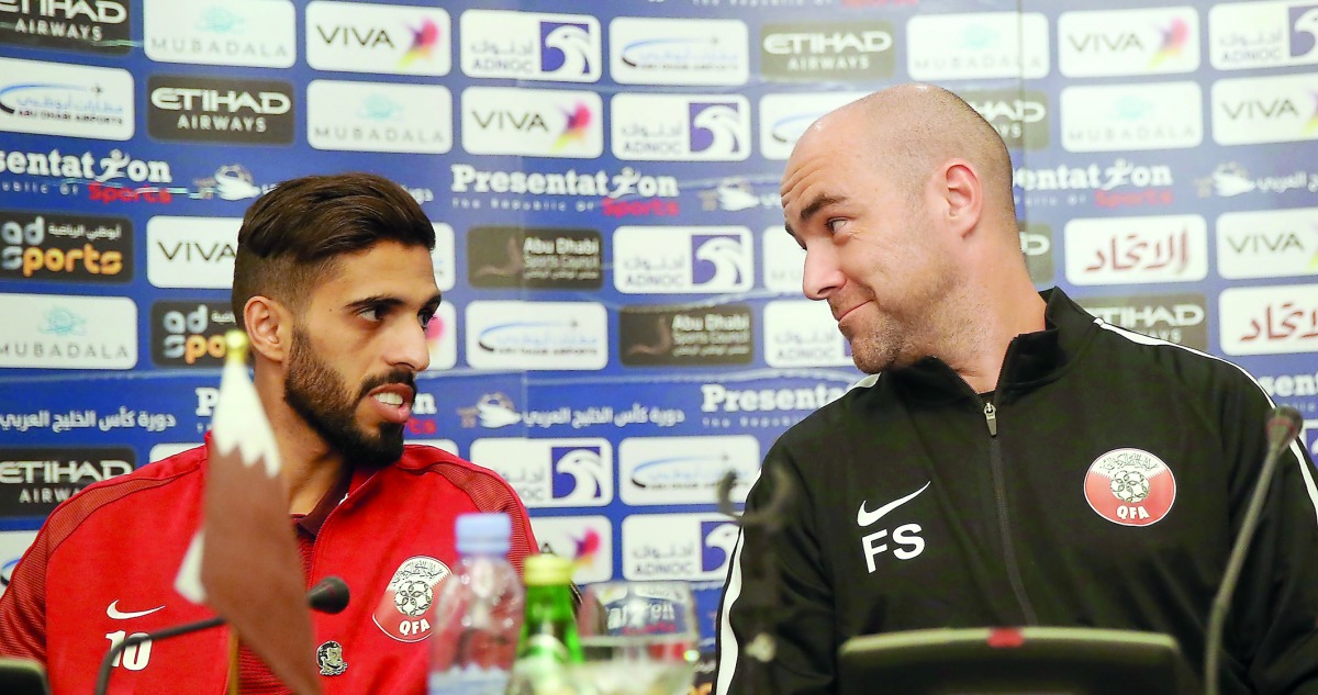 Qatar captain Hassan Al Haydos (left) and coach Felix Sanchez speak during a press conference on the eve of their Gulf Cup match against Yemen in Kuwait yesterday. 