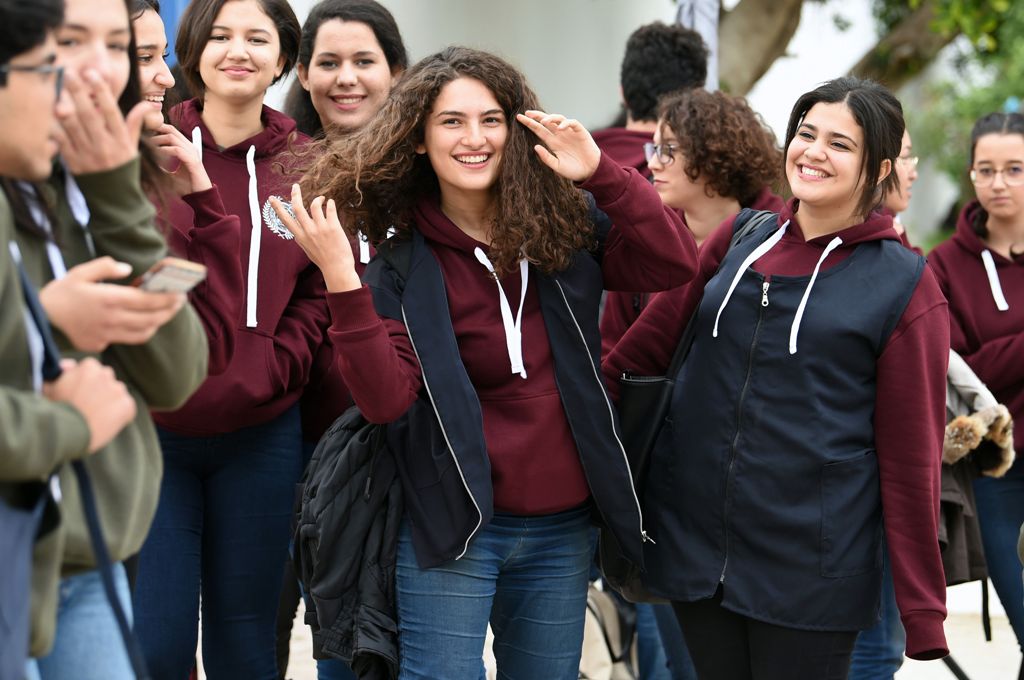 A file photo of Siwar Tebourbi (C), an 18-year-old Tunisian schoolgirl, walking with colleagues as they leave school in Bizerte on November 30, 2017. / AFP / FETHI BELAID