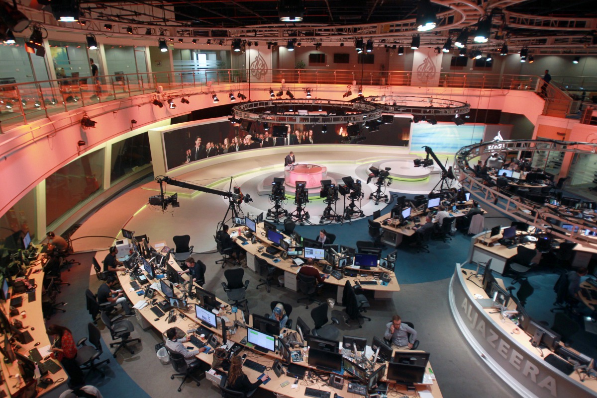 Staff work inside the headquarters of Al Jazeera Network in Doha, June 8, 2017 (Reuters/ Naseem Zeitoon) 