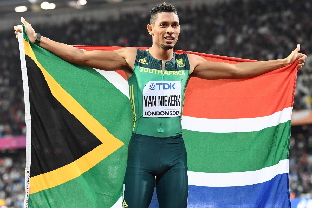 This file photo taken on August 10, 2017 shows South Africa's Wayde Van Niekerk celebrating after winning second place in the final of the men's 200m athletics event at the 2017 IAAF World Championships at the London Stadium in London. AFP / Jewel Samad 