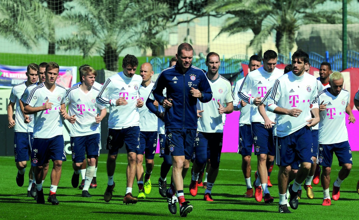 Fans watching Bayern Munich’s training session at Aspire in Doha yesterday. Right: Bayern Munich players during training. Pic: Salim Matramkot/The Peninsula
