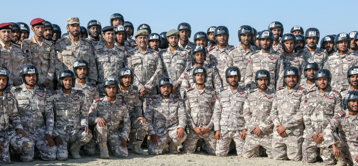 Officials and graduates at the graduation of the 13th batch from Ahmed Bin Mohammed Military College’s members of the parachute jumping course.