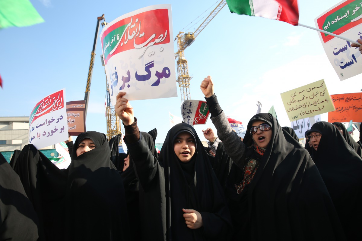 Thousands of Iranians hold banners and posters as they take part in a pro-government rally in Mashhad, Iran on January 4, 2018. (Nima Najafzadeh/ Anadolu)