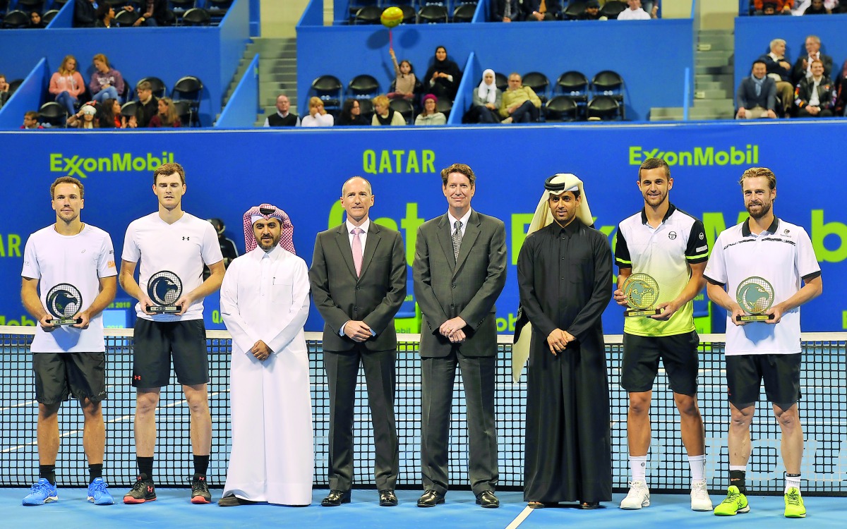 Qatar Tennis Federation (QTF) President Nasser Al Khelaifi (third right) and other officials pose for a photograph with Men’s doubles winners of the  Qatar ExxonMobil Open, M. Pavi? and O. Marach at the Khalifa International Tennis and Squash Complex in D