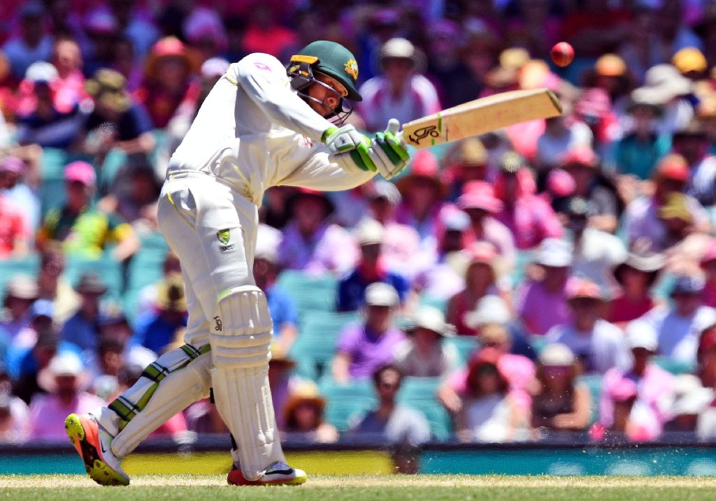 Australia's batsman Usman Khawaja lofts a ball away from England's bowling on the third day of the fifth Ashes cricket Test match at the SCG in Sydney on January 6, 2018. / AFP / WILLIAM WEST /