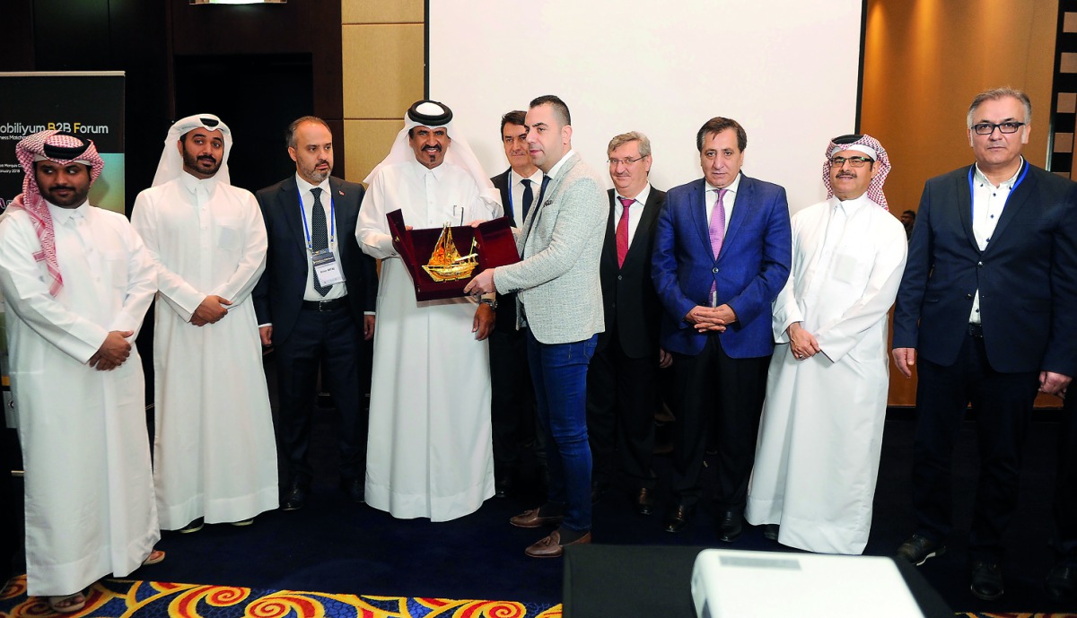 Mohammed bin Ahmed bin Towar Al Kuwari, (fourth left) Vice Chairman of Qatar Chamber presenting a memento to Turkish delegation during the opening of Mobiliyum B2B forum at Marriott Marquis Doha yesterday.  PIC: Abdul Basit/ The Peninsula 

