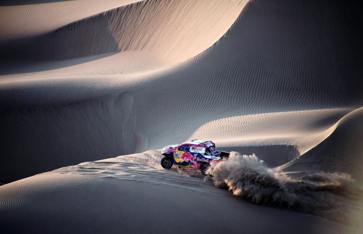 Qatar’s Nasser Al Attiyah of Qatar and Matthieu Baumel of France drive their Toyota during the fifth stage of the 40th Dakar Rally in Arequipa, Peru on Wednesday.