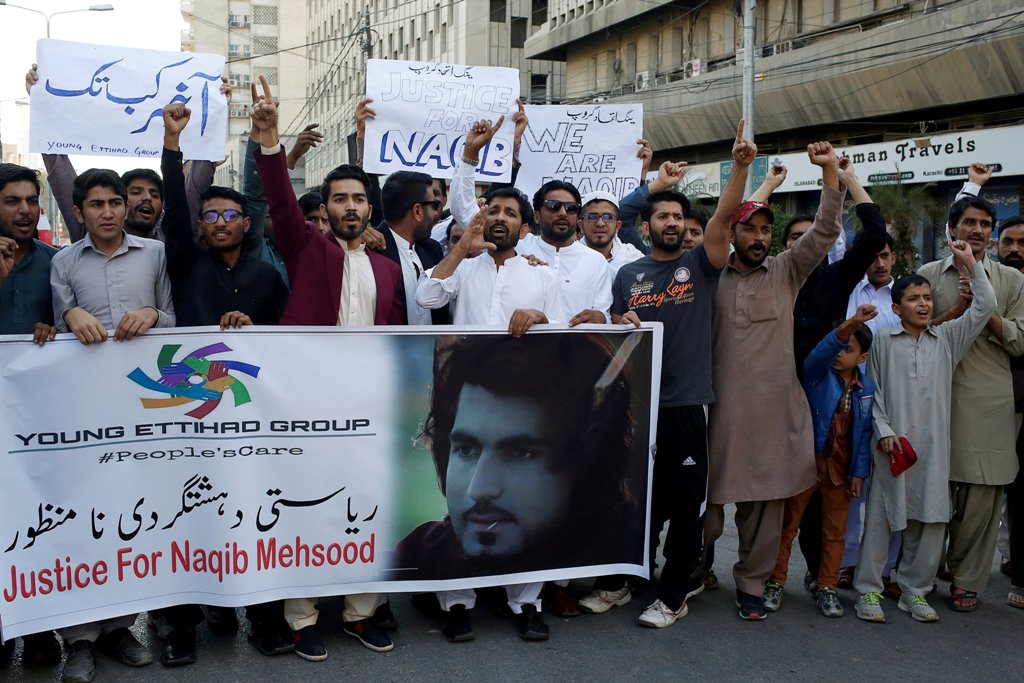File photo of people chanting slogans and holding signs as they condemn the death of Naqibullah Mehsud, during a protest in Karachi, Pakistan January 21, 2018. REUTERS/Akhtar Soomro
