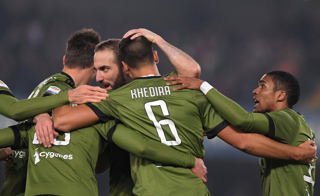 Juventus’ Sami Khedira celebrates scoring their first goal with Gonzalo Higuain and teammates REUTERS/Alberto Lingria	
