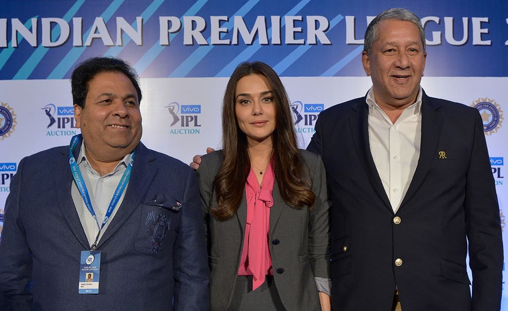 Bollywood actress and owner of Kings XI Punjab Team, Preity Zinta (C), Indian Premier League chairman Rajeev Shukla (L) and Chairman & CEO, Rajasthan Royals, Ranjit Barthakur pose for a photograph after a press conference held on the 2nd day of IPL 2018 P