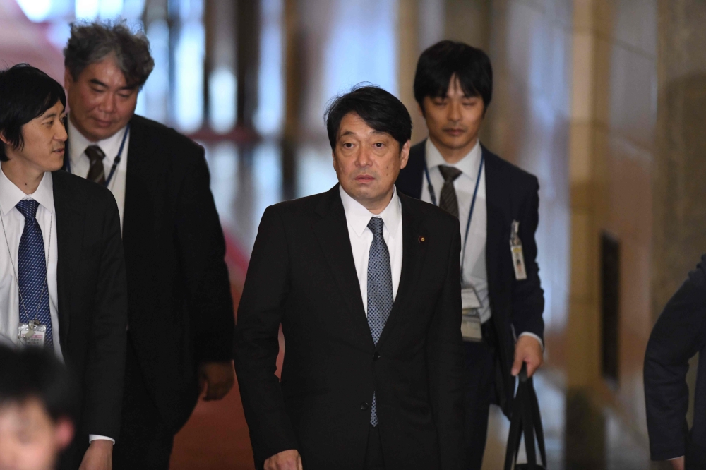 Japan's Defence Minister Itsunori Onodera (2nd R) arrives at parliament to attend a session of the House of Representatives Budget Committee in Tokyo on February 5, 2018. / AFP / Kazuhiro NOGI
