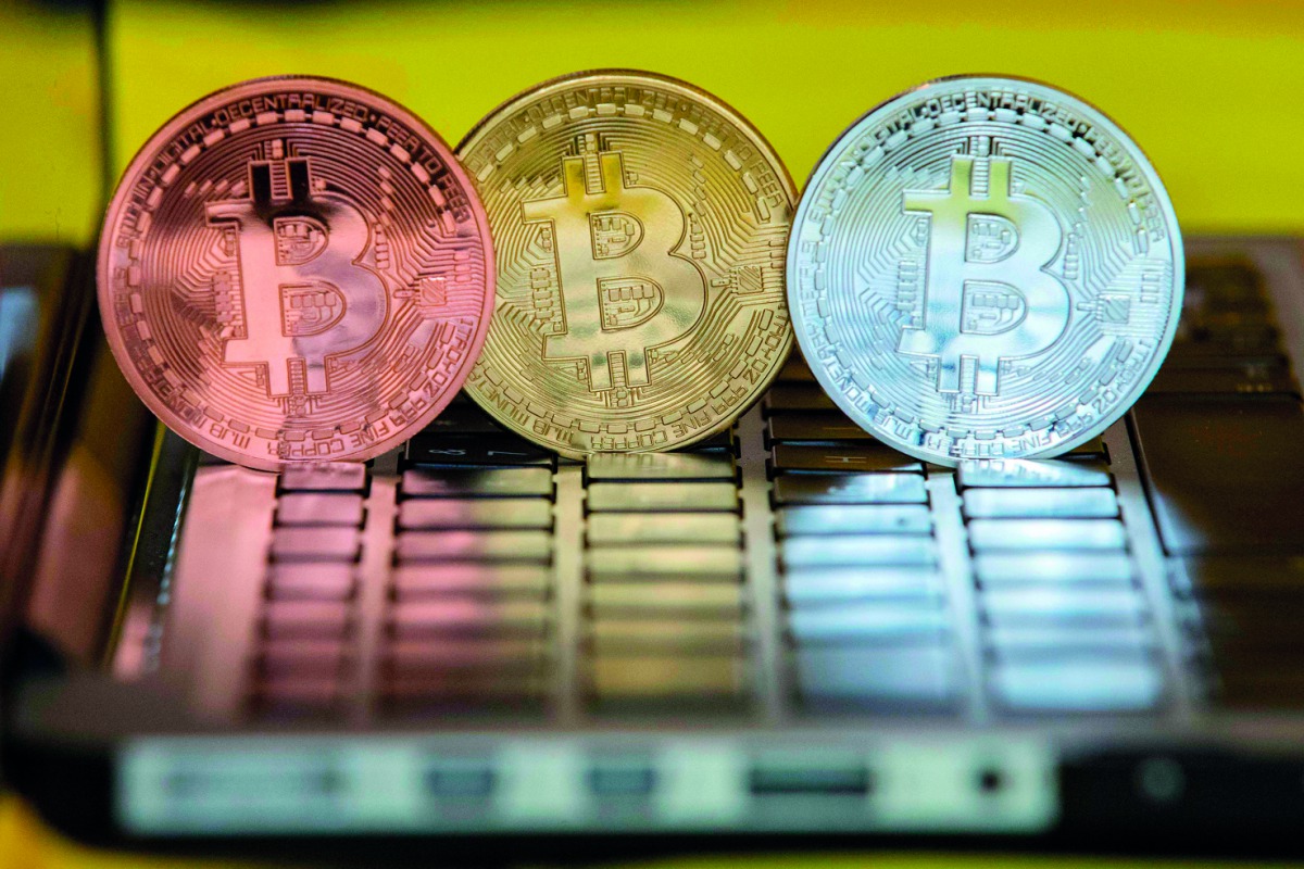 A picture taken on February 6, 2018 shows a visual representation of the digital crypto-currency Bitcoin, at the 