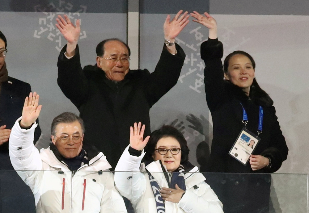 South Korean President Moon Jae-in and his wife Kim Jung-sook, North Korea's nominal head of state Kim Yong Nam, and North Korean leader Kim Jong Un's younger sister Kim Yo Jong wave at the Winter Olympics opening ceremony in Pyeongchang, South Korea Febr
