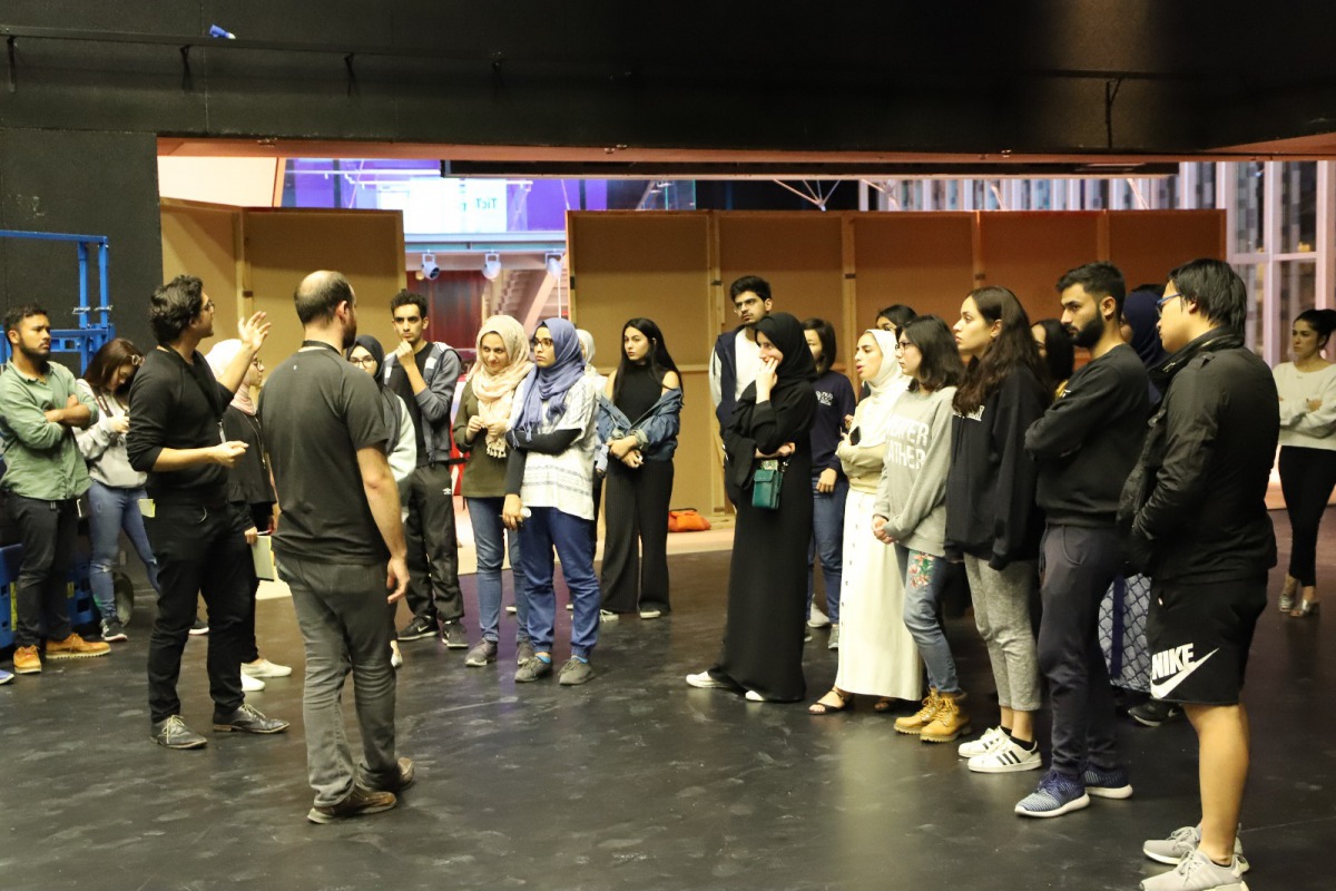  NU-Q students listen to Tom Casserly and George Bajalia at the start of the Creative Media Festival.