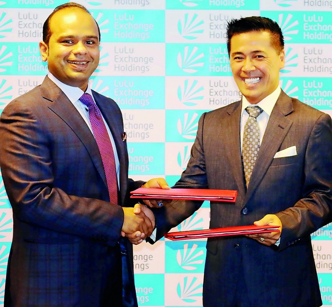 Adeeb Ahamed (left), Managing Director, LuLu Exchange Holdings with Ralph Santos, CEO, ARKIN Technologies Ltd., after signing the partnership deal.