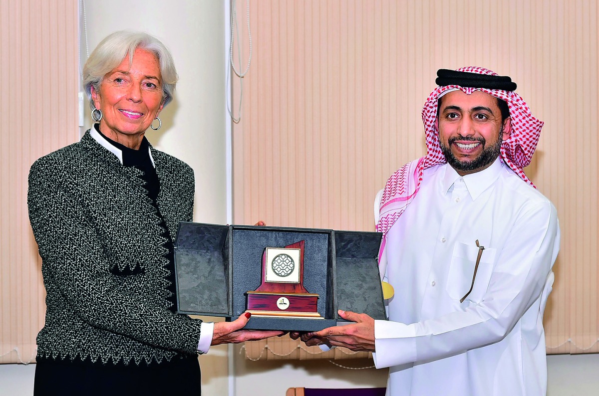 QU President Dr Hassan Al Derham presenting a memento to Christine Lagarde, Managing Director of International Monetary Fund. 