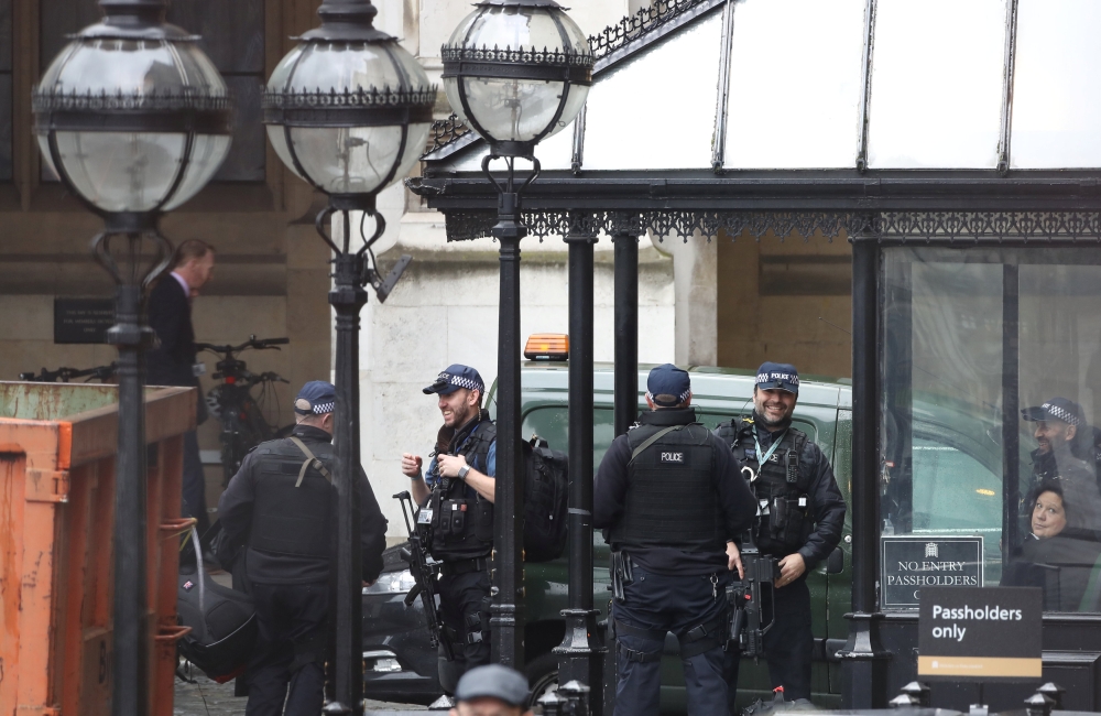 Armed police gather outside an entrance to the Houses of Parliament in London, Britain February 13, 2018. REUTERS/Simon Dawson