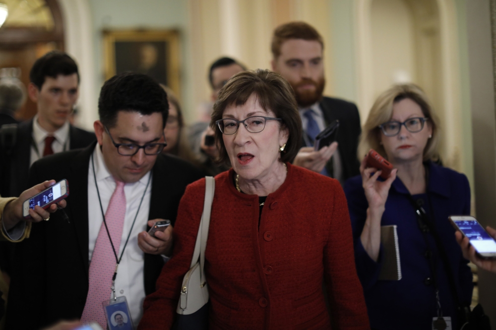 Sen. Susan Collins (R-ME) speaks with reporters on Capitol Hill on February 14, 2018 in Washington, DC. Aaron P. Bernstein/Getty Images/AFP